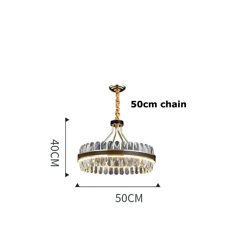 A modern gold stainless steel crystal chandelier with clear droplets and illuminated center for dining room decorbites gold stainless