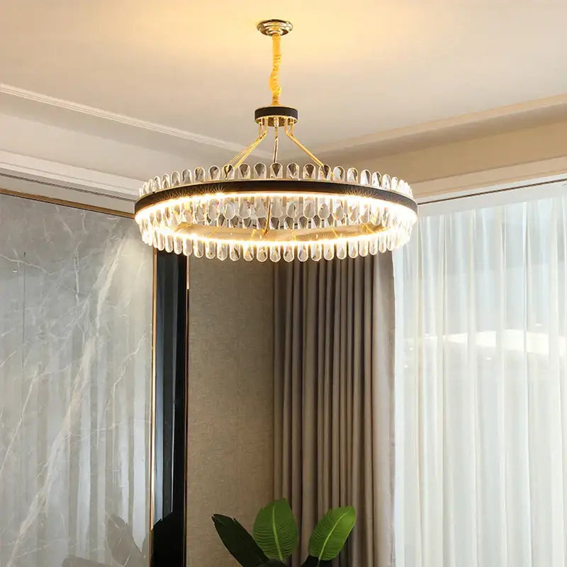 A modern gold stainless steel crystal chandelier with teardrop crystals for dining room decorbites gold stainless design