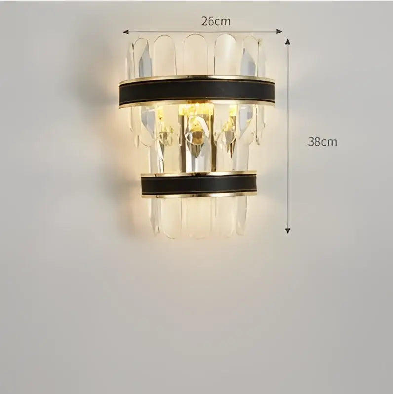 A modern wall sconce with clear crystal prisms and black leather bands in gold stainless steel crystal decorbites gold stainless design