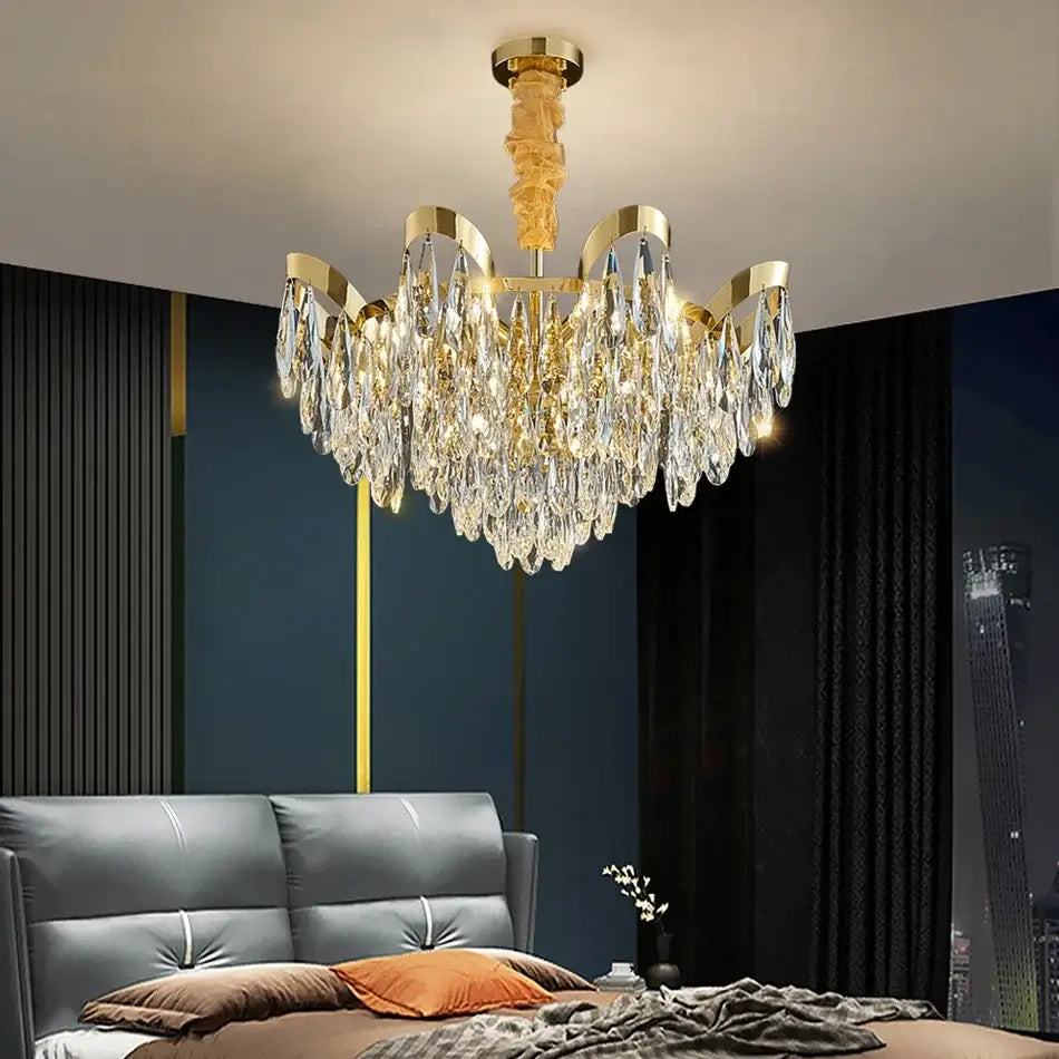 Gold-toned decorbites led sunflower crystal ceiling chandelier with cascading crystal droplets and polished brass finish