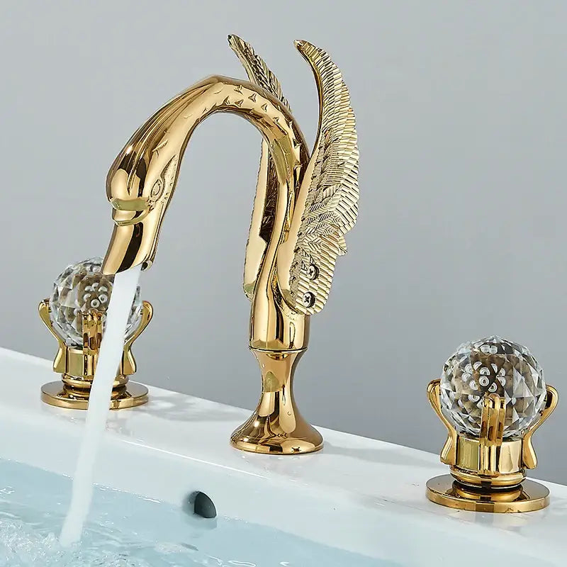 Gold swan crystal handle bathroom faucet with intricate feather detailing and crystal knobs by decorbites gold swan