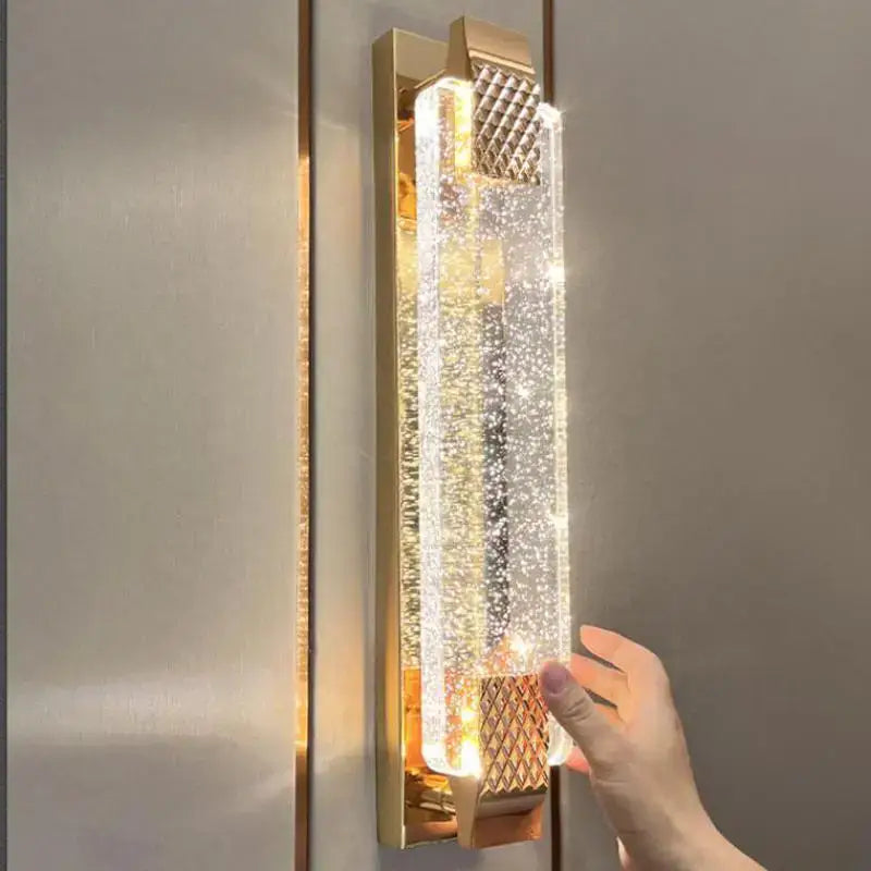 Gold textured bubble glass led wall lamp with clear textured crystal panel emitting warm light for bedroom decorbites bubble glass