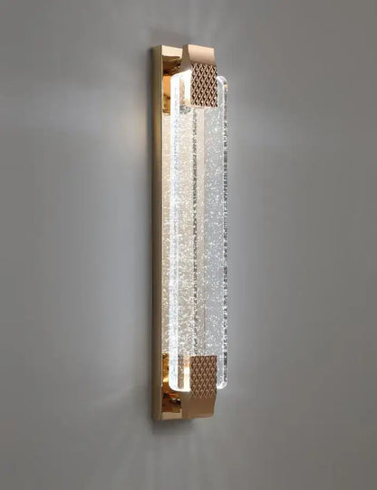 Gold-toned wall lamp with textured crystal panel and frosted glass accents decorbites bubble glass led bedroom sconce