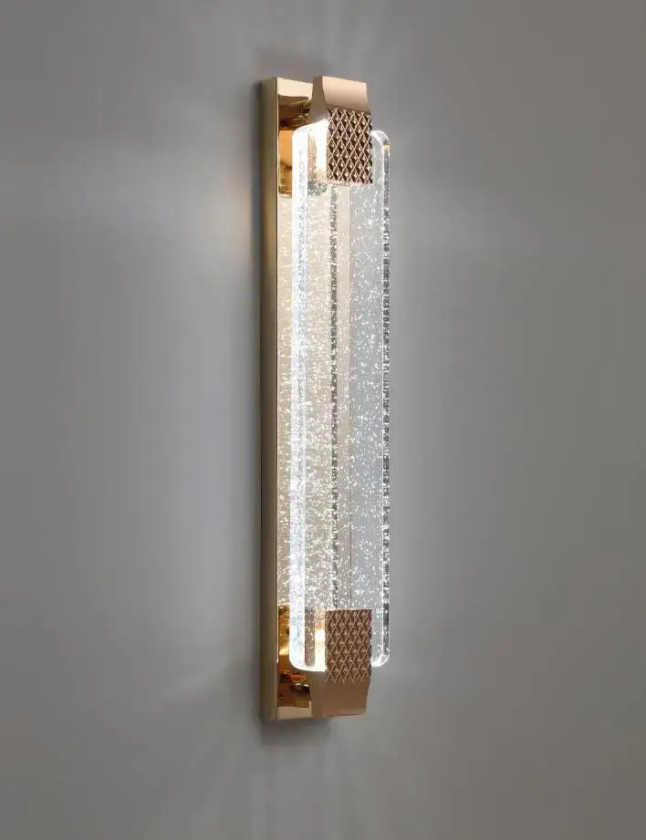 Gold-toned wall lamp with textured crystal panel and frosted glass accents decorbites bubble glass led bedroom sconce