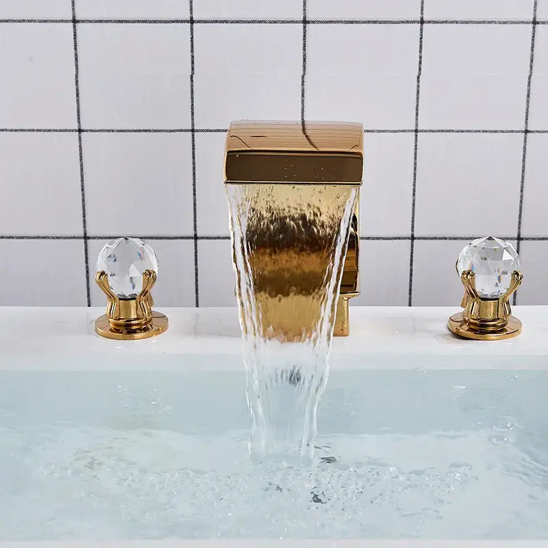 Gold waterfall double handle basin faucet in gold tone with crystal knob handles for elegant bathroom decorbites gold waterfall design