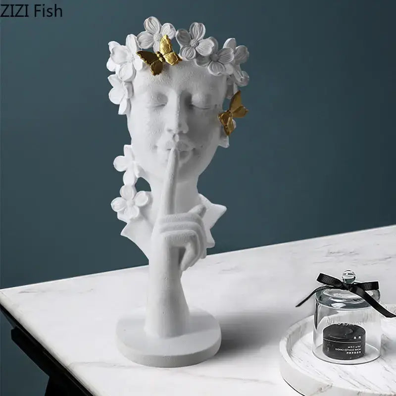 White resin garland figure sculpture of a woman with gold butterflies and white flowers shushing for living room decorbites gold silence