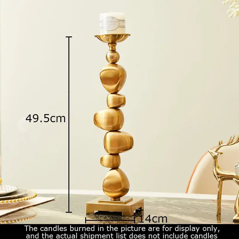 Golden alloy stone pile candle holder with stacked smooth spheres and square base for decorbites golden alloy decor