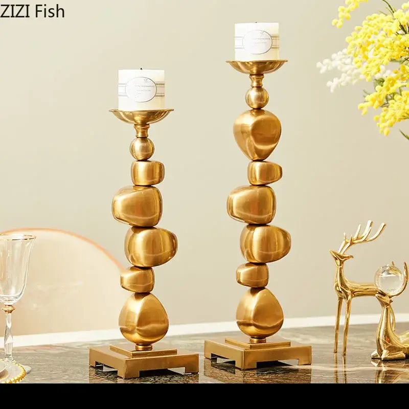 Golden alloy stone pile candle holder with stacked stone design and sleek metallic finish for living room decorbites golden alloy decor