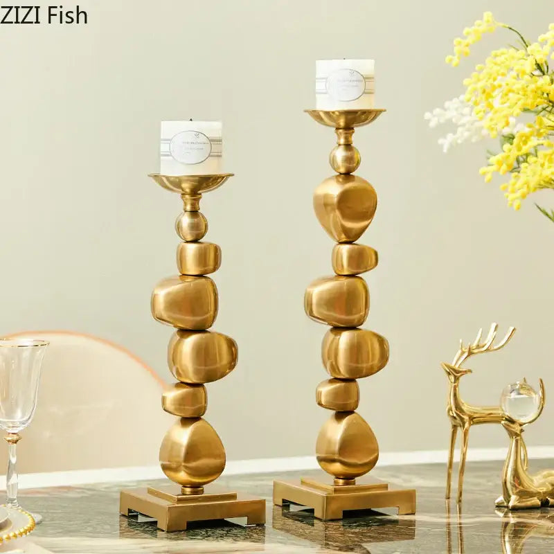 Golden alloy stone pile candle holder with stacked stone design and sleek metallic finish for living room decorbites decor