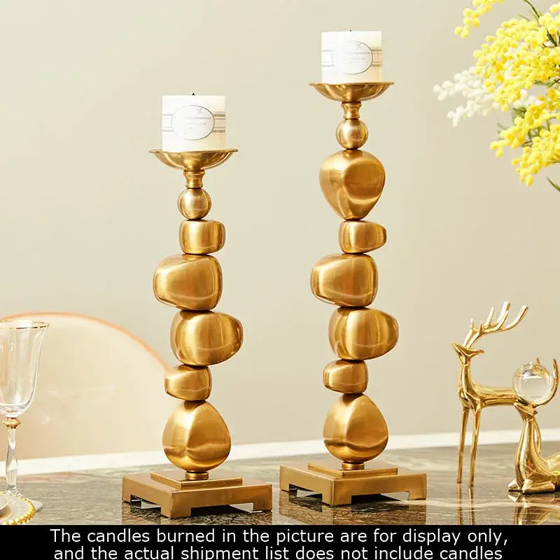 Golden alloy stone pile candle holder with a polished metallic finish for living room decorbites golden alloy decor