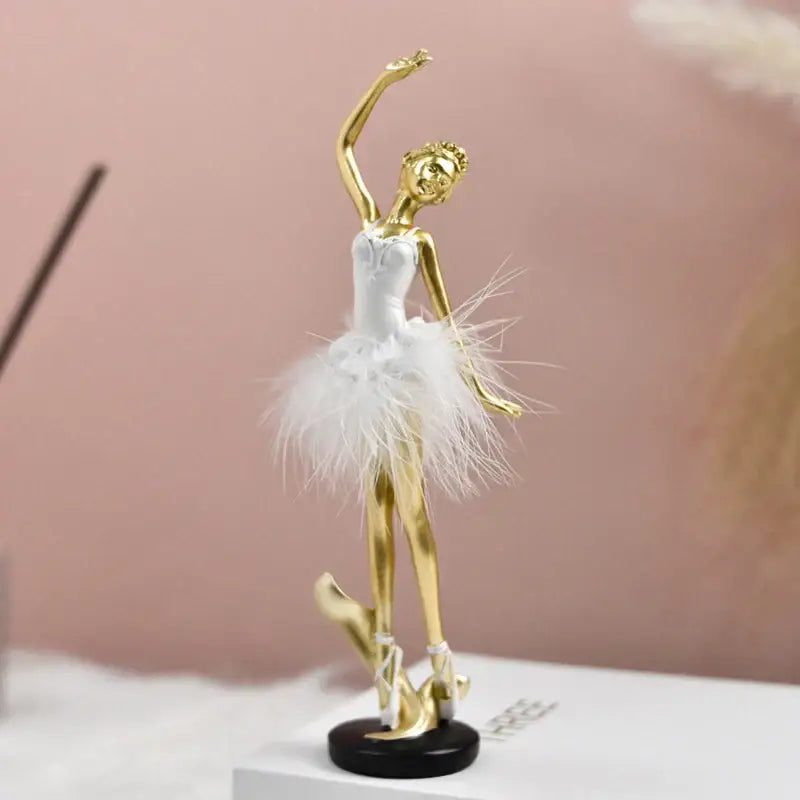 Golden ballet girl resin figurine with white feathered tutu and black base for bedroom desktop decor