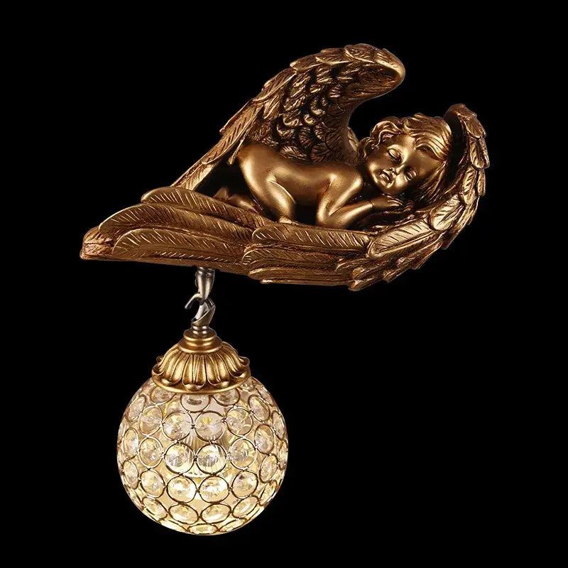 Golden angel wall lamp with detailed wings and sleeping cherub suspended above ornate crystal globe for living room