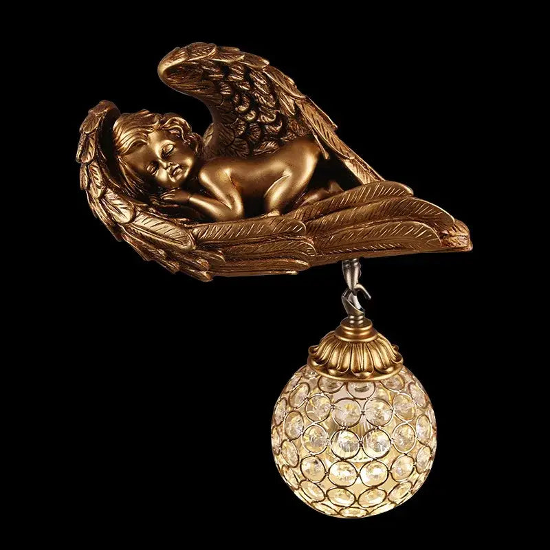 Golden angel wall lamp with detailed wings and crystal globe designed for elegant living room lighting