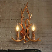 Golden antler deer horn wall lamp with two lit candle-style bulbs for living room decorbites deer horn decor