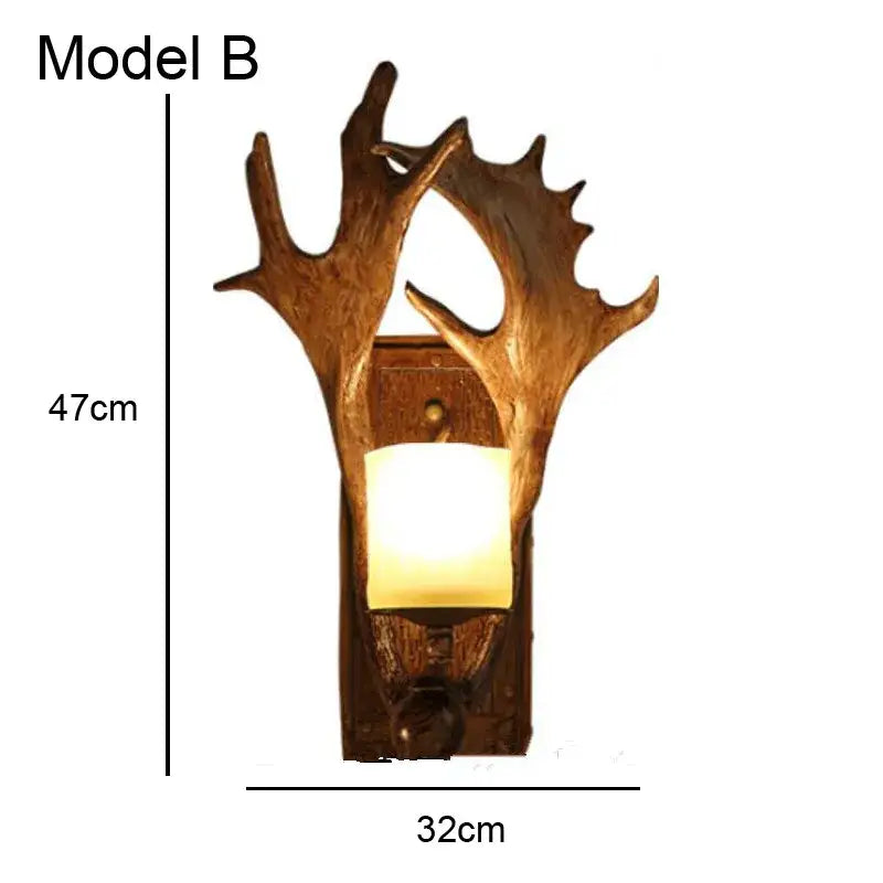 Golden antler deer horn wall lamp with warm glowing light in rustic wooden base for living room decorbites deer horn decor