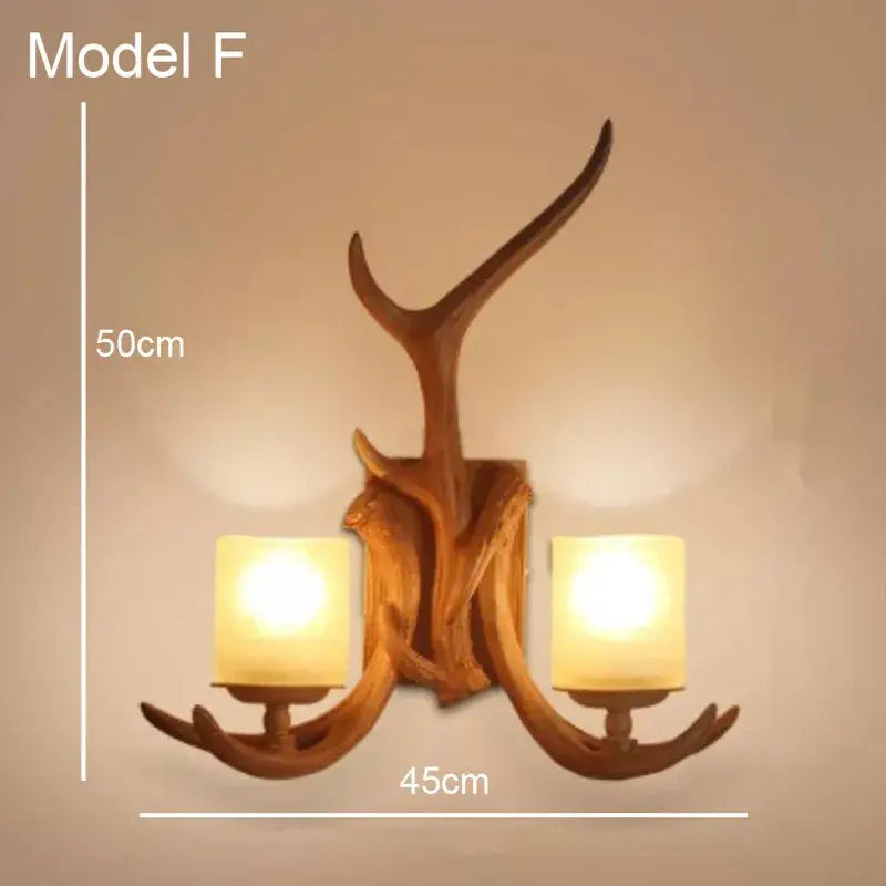 Golden antler deer horn wall lamp with two warm glass shades and rustic wooden finish decorbites deer horn decor