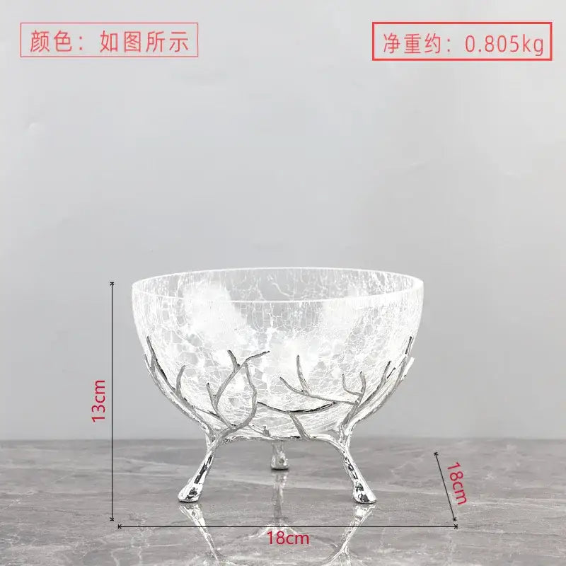 A clear crackled glass fruit plate with a silver-toned antler metal base dining room centerpiece bowl
