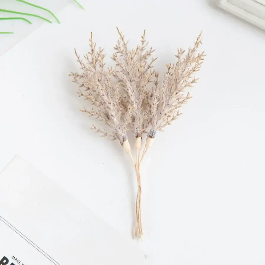 Golden artificial autumn branches set with delicate beige dried foliage and natural wood stem for living room decorbites decor
