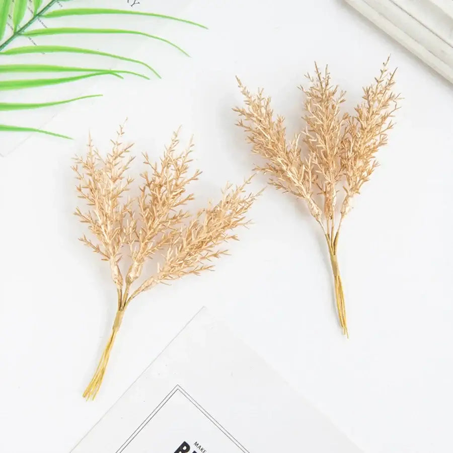 Two golden dried grass-like artificial autumn branches set with feathery textures for decorbites artificial autumn decor