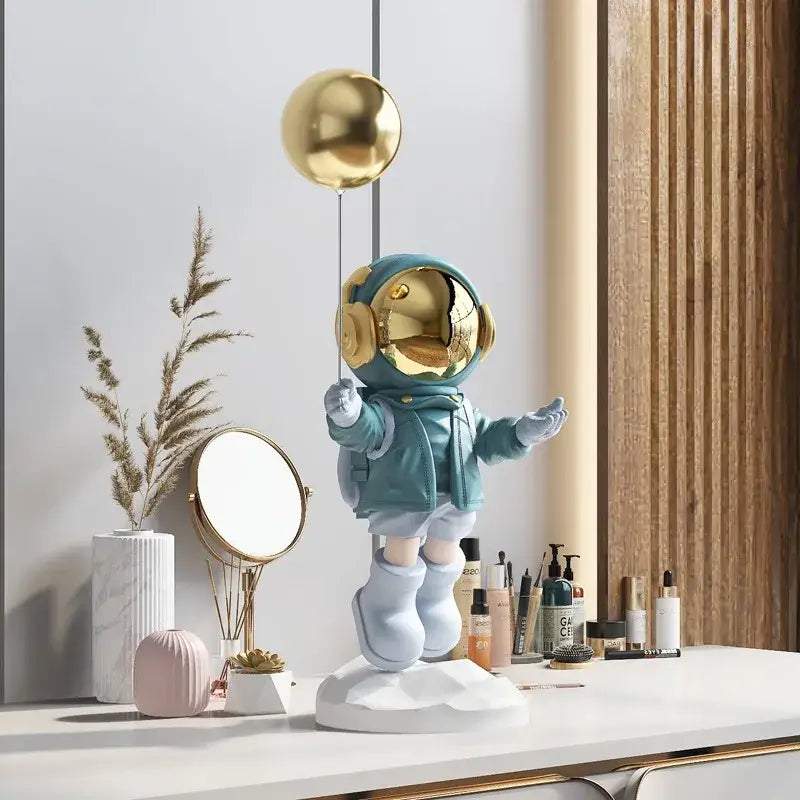 Teal balloon astronaut resin figurine with gold helmet standing on white base for resin home decor living room statue