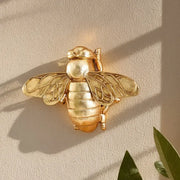 Golden bee resin wall hanger with detailed wings and segmented body for living room decorbites golden bee decor