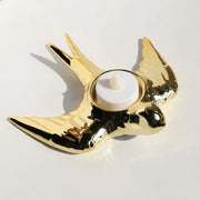 Golden swallow-shaped ceramic candle holder tray with glossy finish and black accents for led tea light decor