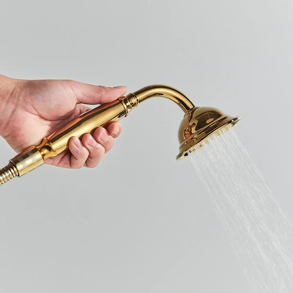 Gold-colored sleek handheld showerhead with curved spout and textured grip from decorbites golden bird freestanding faucet