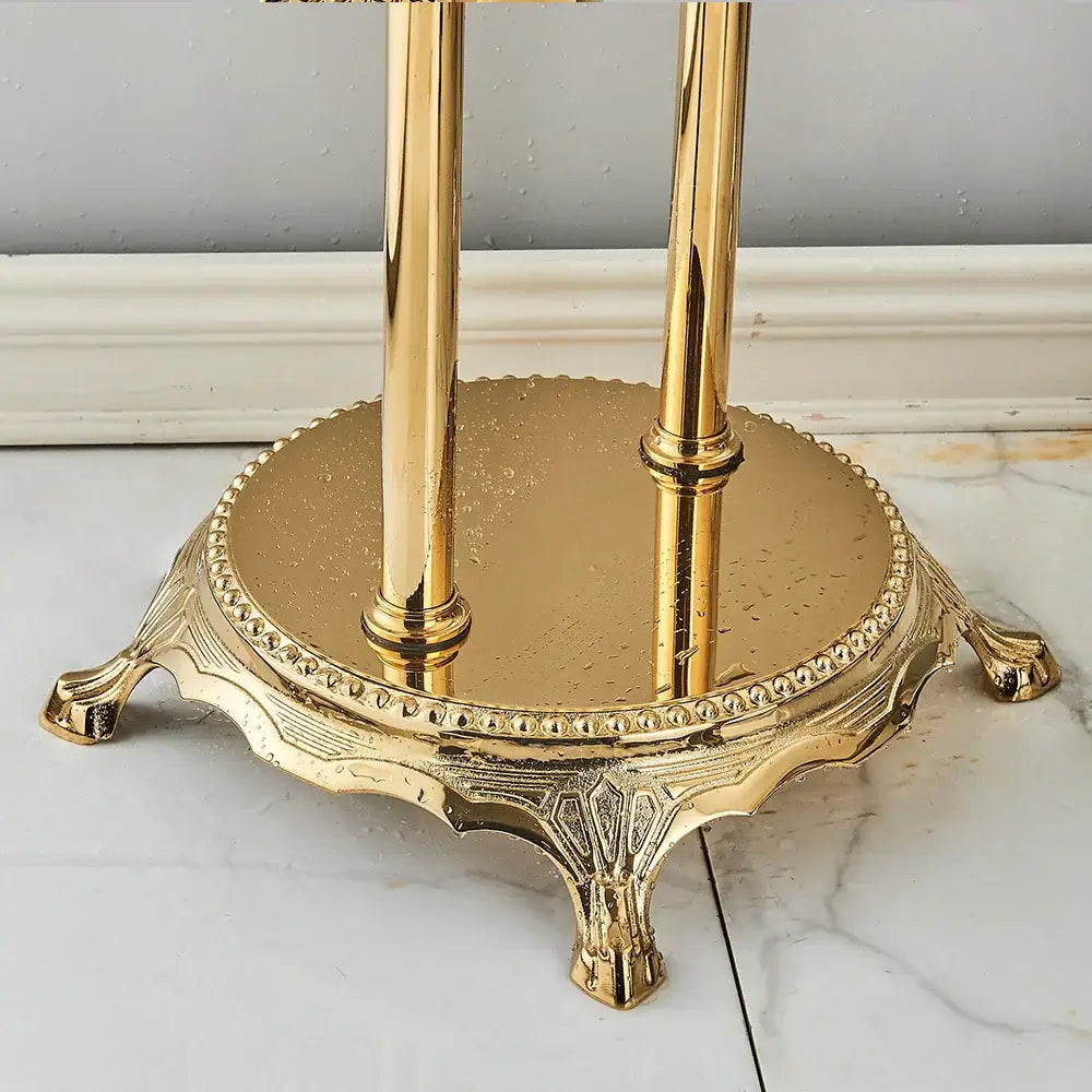 Golden brass umbrella stand with ornate claw-footed base and polished poles for decorbites golden bird freestanding bathroom