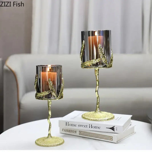 Gold-toned glass candle holders with gold leaf accents twisted stems and glittery bases decorbites golden branches candle decor
