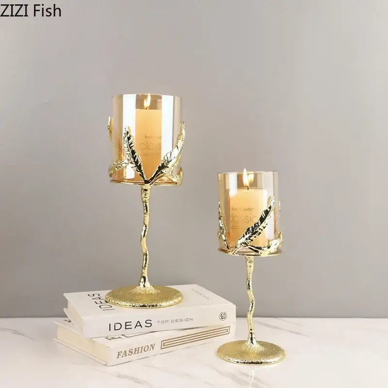 Gold leaf-adorned glass candle holders with twisted metallic stems from decorbites golden branches candle collection