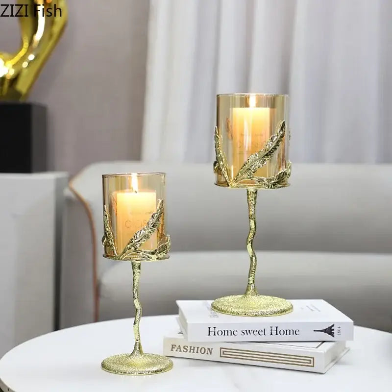 Gold leaf patterned candle holders with clear glass cups and twisted stems from decorbites golden branches candle collection
