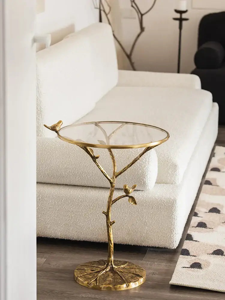Golden brass decorbites brass bird side table with glass top and bird figurines on branch legs for living room decor