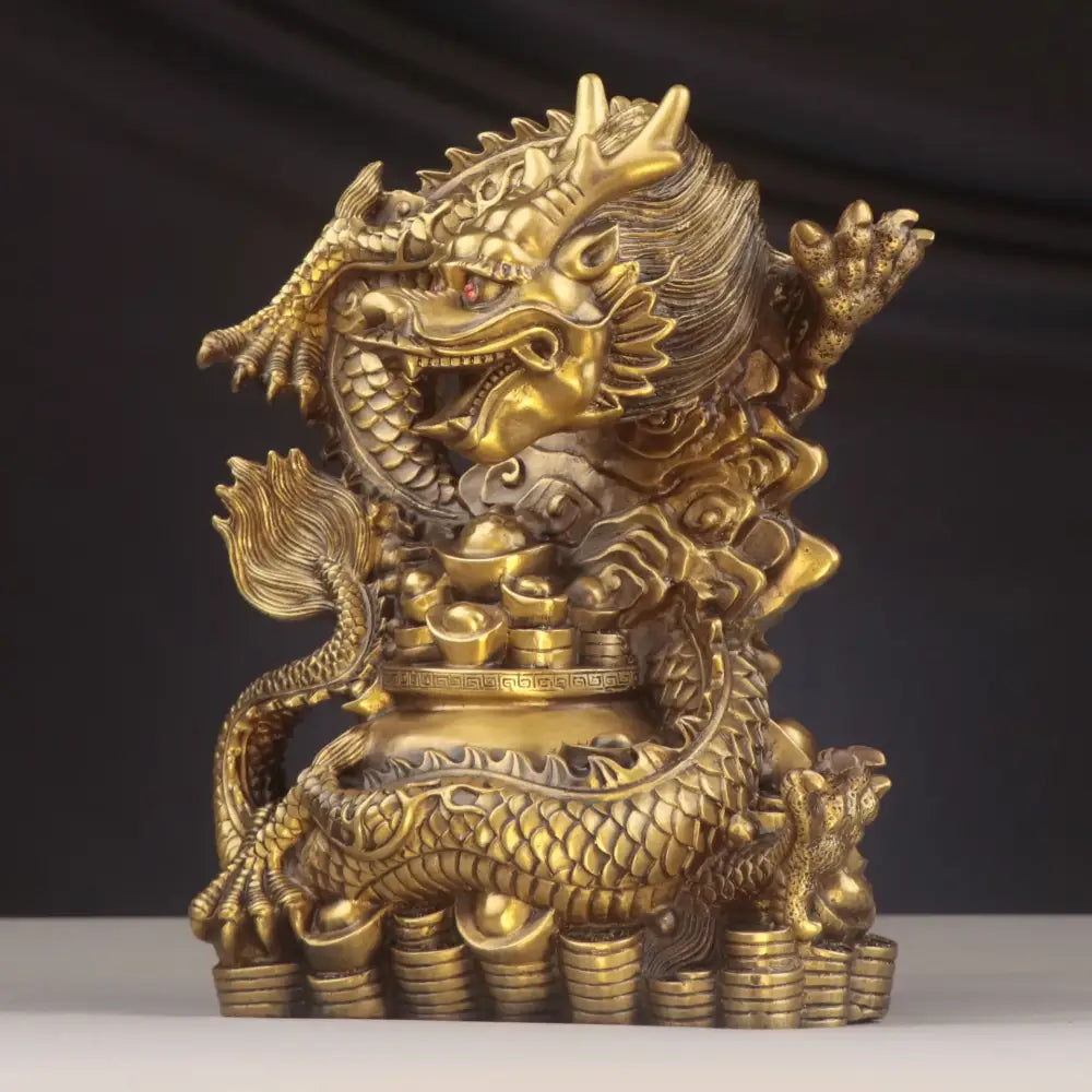 Golden brass dragon copper bowl ornament with intricate scales holding coins surrounded by gold ingots for living room decor