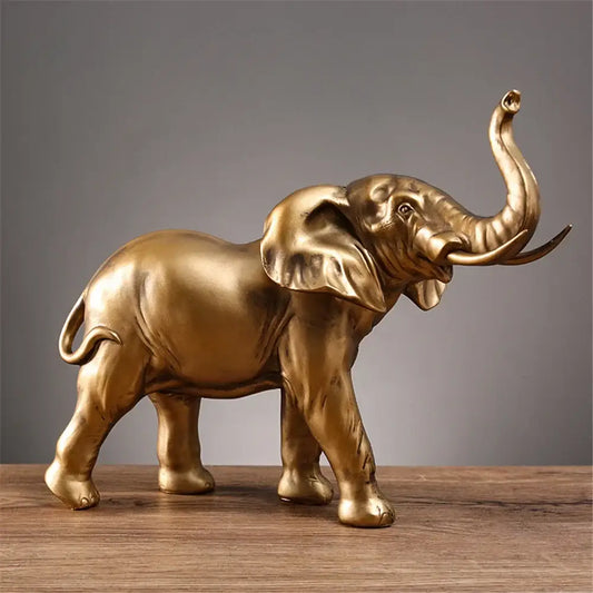 Golden brass elephant resin sculpture with detailed sculpted features and raised trunk for living room decorbites elephant resin decor