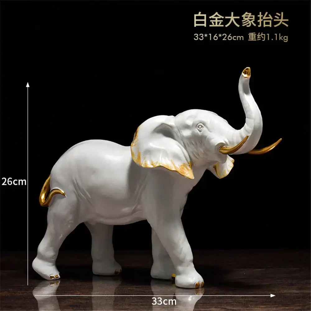 White porcelain elephant resin sculpture with gold accents for living room decor by decorbites elephant resin
