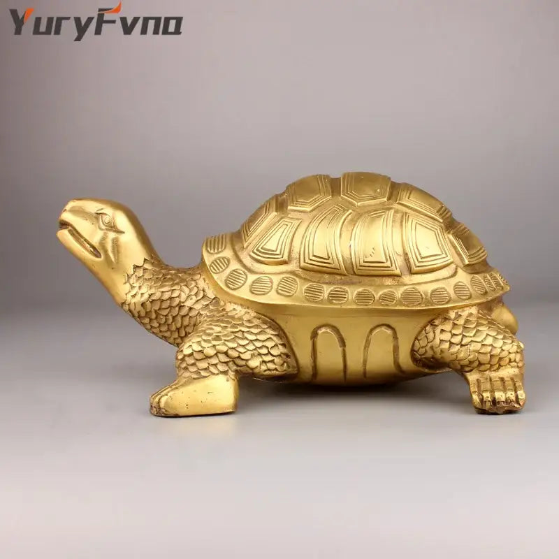 Golden brass feng shui turtle statue with detailed scaly texture and geometric shell patterns for living room decor
