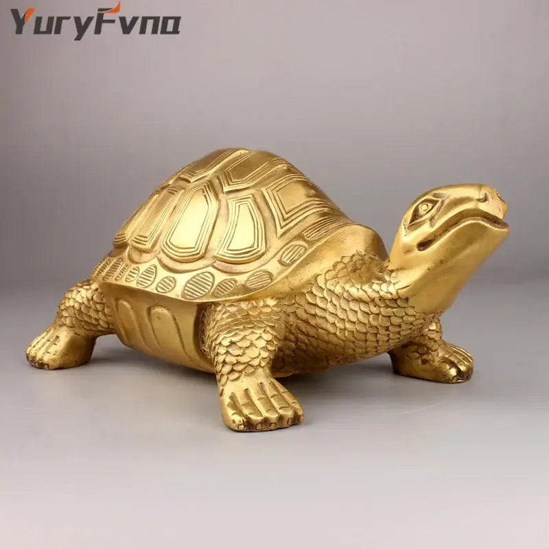Golden brass feng shui turtle statue with detailed scaly texture and engraved shell patterns for living room decor