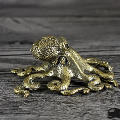 Antique golden brass octopus sculpture with textured detailed surface and coiled tentacles for living room decor