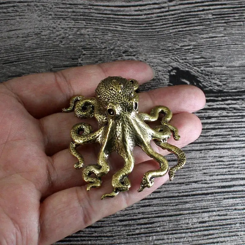 Detailed golden brass octopus sculpture with textured skin and coiled tentacles for living room decorbites decor
