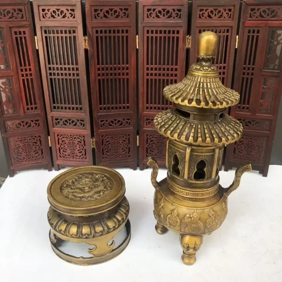 Golden brass three tiered tower incense burner with intricate pagoda design and dragon motif lid for buddhist hall decor