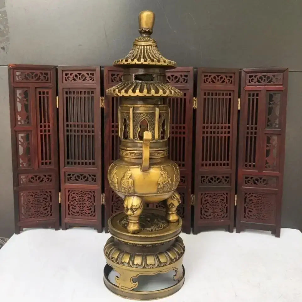 Golden brass three tiered tower incense burner with intricate carvings and elephant feet tripod furnace for Buddhist decor