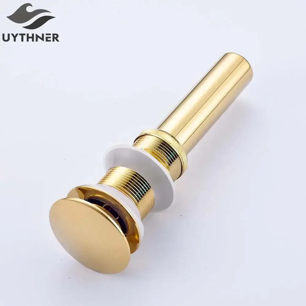 Golden brass vintage bathroom sink pop up drain with a sleek polished metallic finish by decorbites golden brass