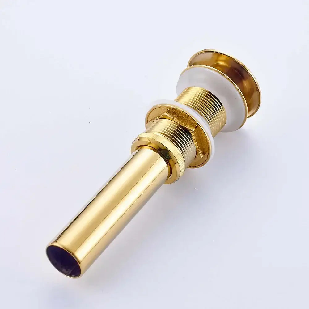 Golden brass vintage bathroom sink pop up drain with gold-toned metal and white ceramic accents by decorbites golden brass