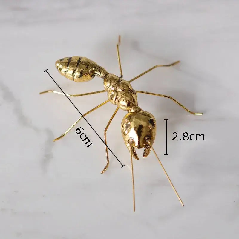 Golden butterfly ant miniature metal figurine with detailed segmented body and articulated legs for living room decor