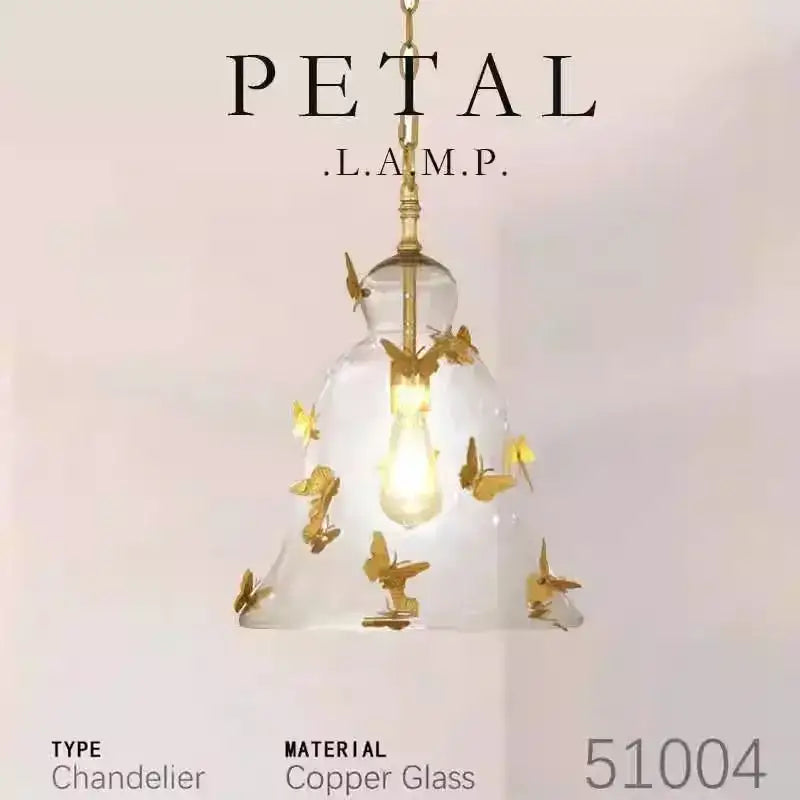 Delicate copper glass bedhead glass pendant lamp with golden butterfly accents and warm glowing bulb for dining room