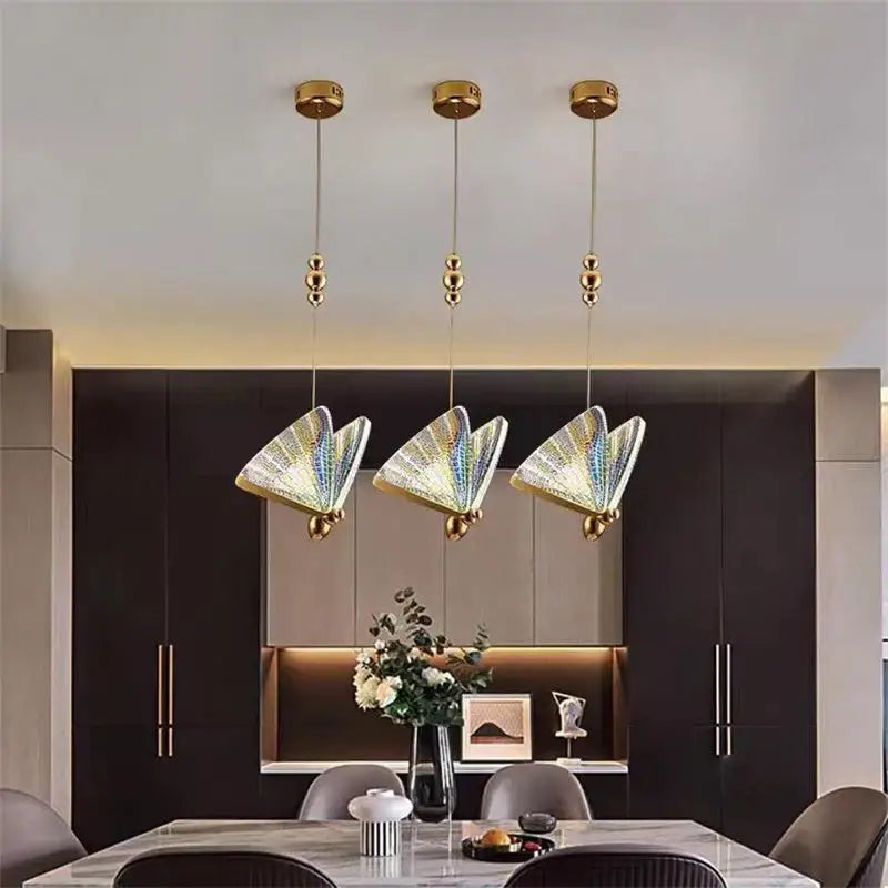 Three elegant gold butterfly led pendant lights with iridescent glass shades for bedroom and dining room decorbites butterfly led