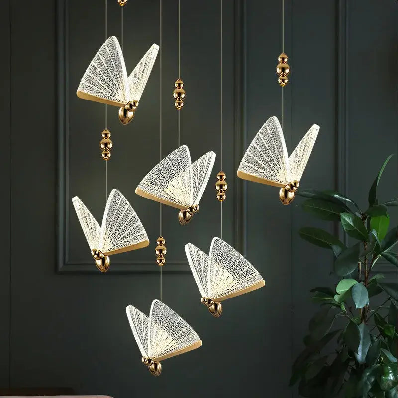Elegant white butterfly led pendant light with gold-toned accents and lace-like detailing for kitchen and dining room