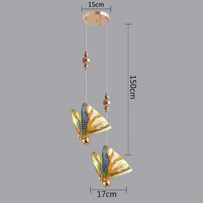 Gold-toned led pendant light with two butterfly designs featuring iridescent wings and beads for kitchen and dining room