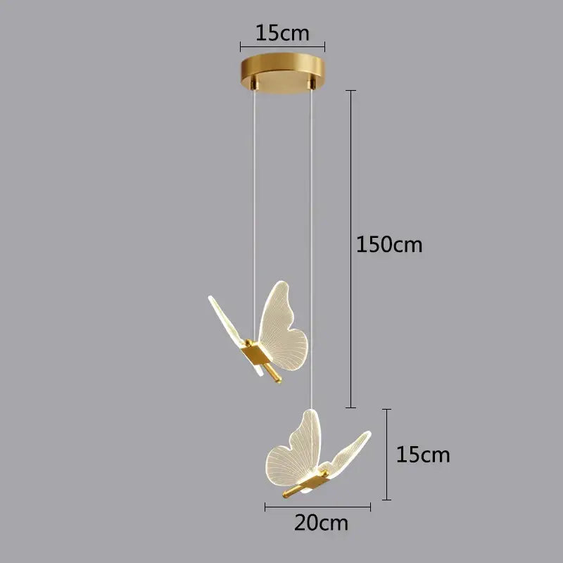Gold-toned butterfly led pendant light with translucent wings and sleek design for kitchen and dining room chandelier