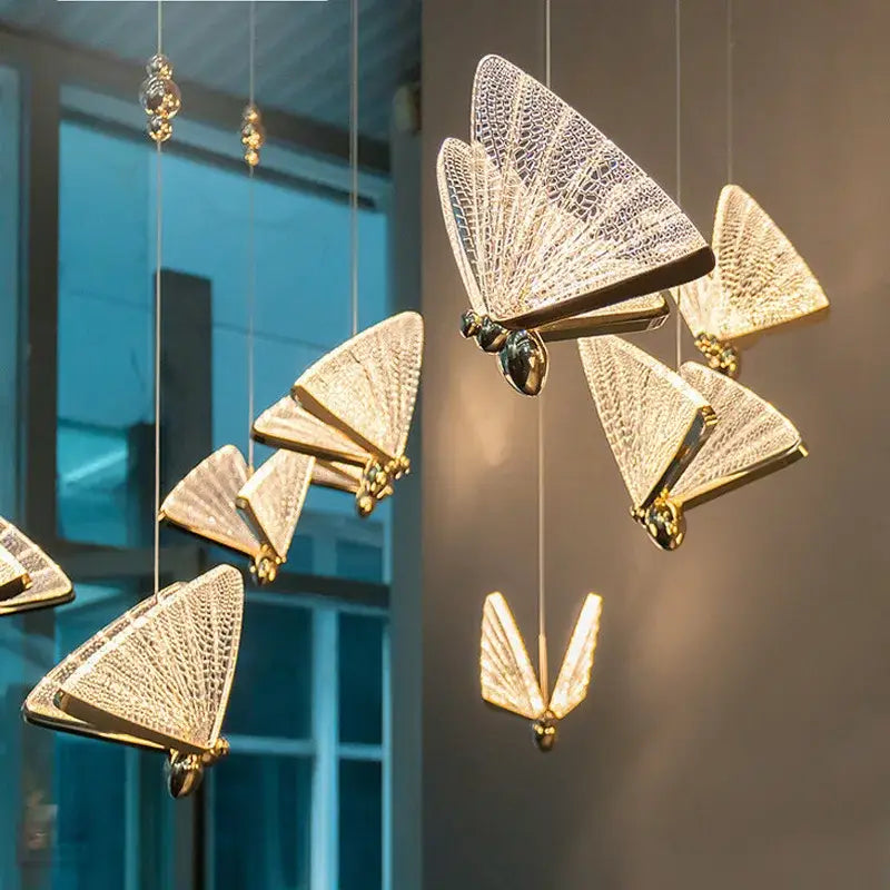 Golden butterfly led pendant light with intricate mesh wings and metallic bodies for kitchen and dining room pendant chandelier